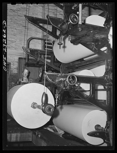 Untitled photo, possibly related to: Dallas, Texas. Rolls of newsprint at the back end of the press at the Dallas Morning News