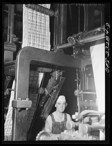 Untitled photo, possibly related to: Dallas, Texas. Rolls of newsprint at the back end of the press at the Dallas Morning News
