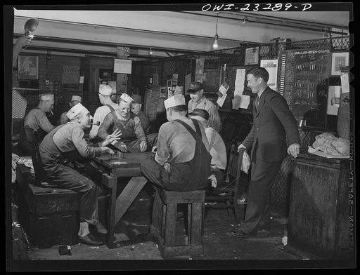 Dallas, Texas. Press operators on the Dallas Morning News playing dominos while waiting for the forms to come down from the composing room