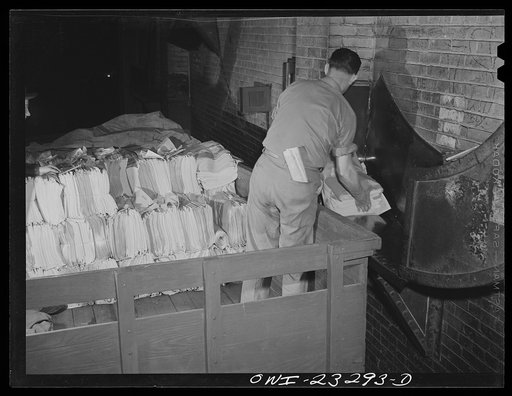 Dallas, Texas. Loading bundles of the Dallas Morning News onto trucks for delivery