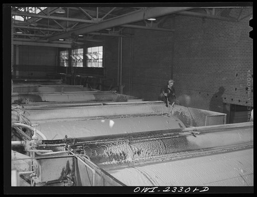 Untitled photo, possibly related to: Lufkin, Texas. Southland paper mill. Vacuum decker which draws water off the ground wood to thicken the stock before the chemical stock is added