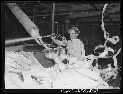 Lufkin, Texas. Southland paper mill. Waste paper from the trimmed edges of newsprint rolls blows down to the basement to a vat where it is converted back into pulp