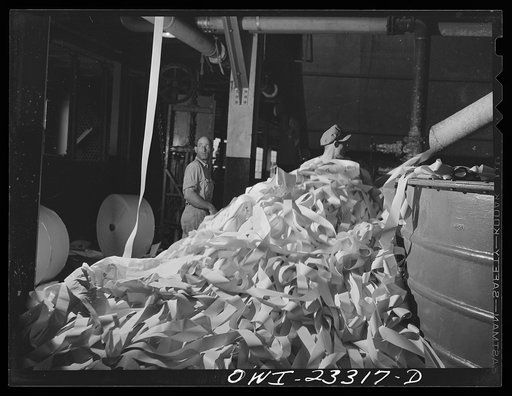 Lufkin, Texas. Southland paper mill. Waste paper from the trimmed edges of newsprint rolls blows down to the basement to a vat where it is converted back into pulp