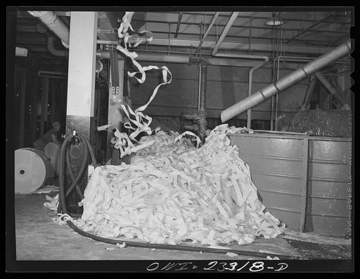 Lufkin, Texas. Southland paper mill. Waste paper from the trimmed edges of newsprint rolls blows down to the basement to a vat where it is converted back into pulp