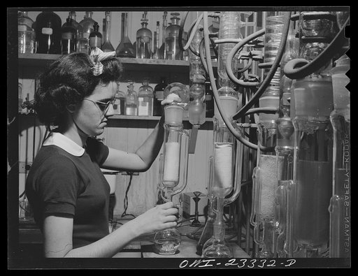 Lufkin, Texas. Southland paper mill. Laboratory worker conducting a test with pitch obtained from pulpwood