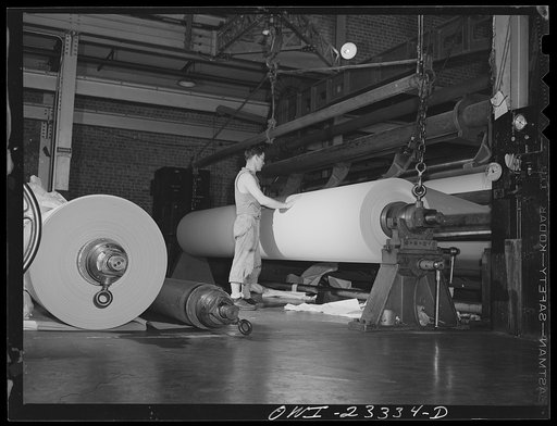 Lufkin, Texas. Southland paper mill. Roll of newsprint coming off the dry end of a paper machine
