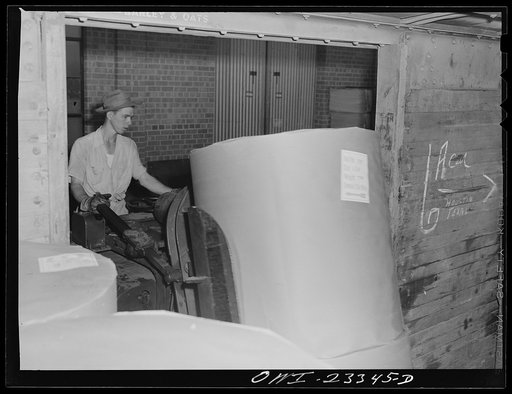 Lufkin, Texas. Southland paper mill. Loading roll of newsprint into a freight car