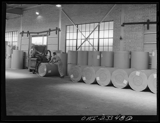 Lufkin, Texas. Southland paper mill. Jitney picking up roll of newsprint for loading onto freight car