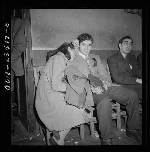 Buffalo, New York. Tired swingshift workers sitting on the sidelines at the swingshift dance held weekly from midnight to 4 a.m. at the Main-Utica ballroom