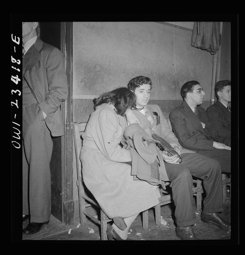Buffalo, New York. Tired swingshift workers sitting on the sidelines at the swingshift dance held weekly from midnight to 4 a.m. at the Main-Utica ballroom