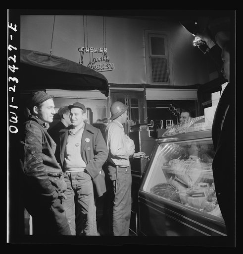 Untitled photo, possibly related to: Baltimore, Maryland. Third shift defense workers waiting in a combination delicatessen and restaurant to be picked up by their car pools around midnight