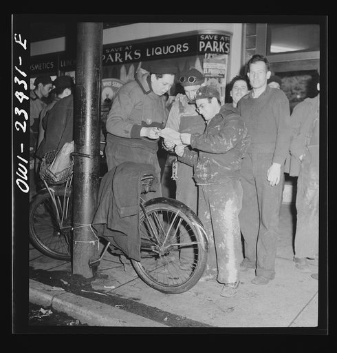 Untitled photo, possibly related to: Baltimore, Maryland. Third shift workers waiting on a street corner to be picked up by car pools around midnight