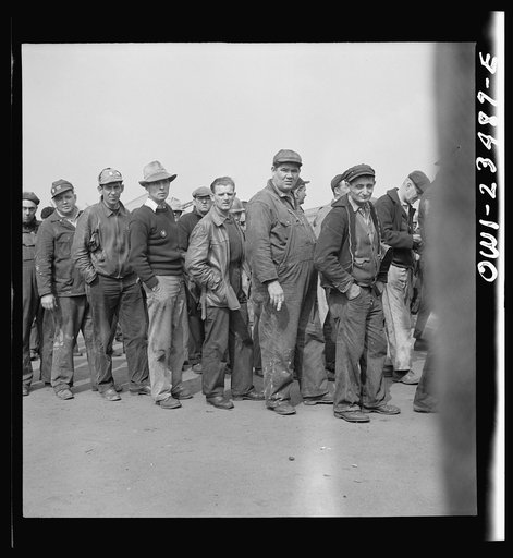 Bethlehem-Fairfield shipyards, Baltimore, Maryland. Lining up before a time clock