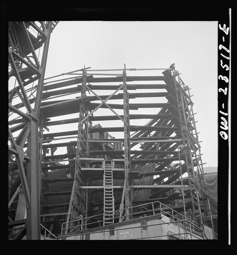 Bethlehem-Fairfield shipyards, Baltimore, Maryland. Looking at the forepeak of a vessel through staging