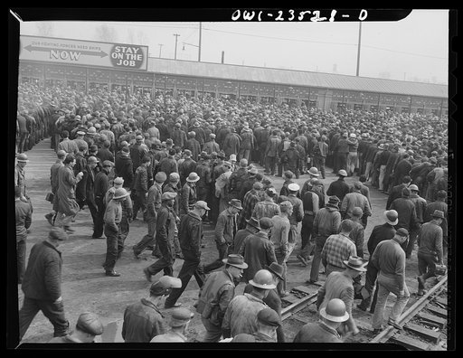 Bethlehem-Fairfield shipyards, Baltimore, Maryland. Day shift lining up before the time clocks to punch out