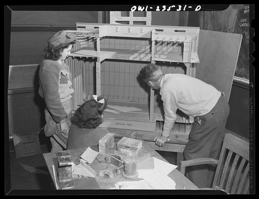 Bethlehem-Fairfield shipyards, Baltimore, Maryland. Looking at a model of a cargo hold in a training school