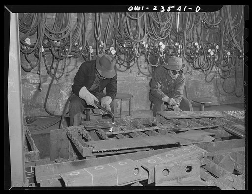 Bethlehem-Fairfield shipyards, Baltimore, Maryland. Burning lifting pads from a scrap angle