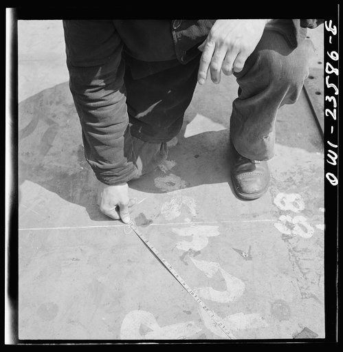 Bethlehem-Fairfield shipyards, Baltimore, Maryland. A ship fitter at work