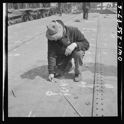 Bethlehem-Fairfield shipyards, Baltimore, Maryland. A ship fitter at work