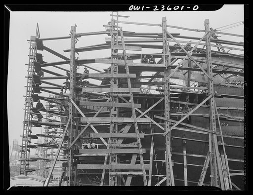 Bethlehem-Fairfield shipyards, Baltimore, Maryland. Eating lunch on a staging