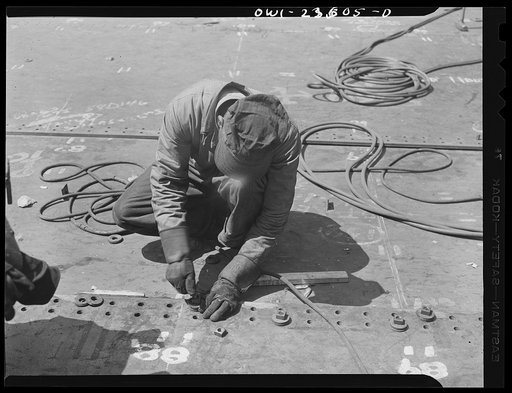 Bethlehem-Fairfield shipyards, Baltimore, Maryland. Bolting a bottom shell