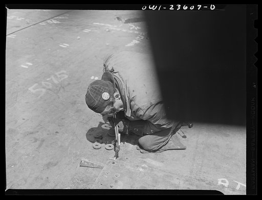Untitled photo, possibly related to: Bethlehem-Fairfield shipyards, Baltimore, Maryland. Chipper beveling shell plates for welding