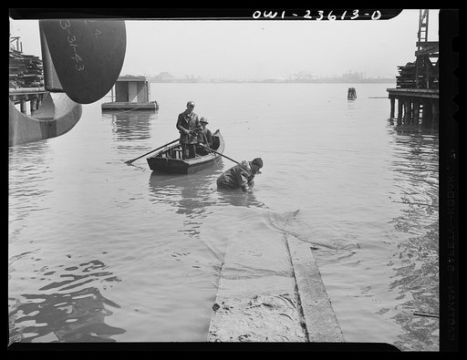 Bethlehem-Fairfield shipyards, Baltimore, Maryland. Inspecting cutboard ways