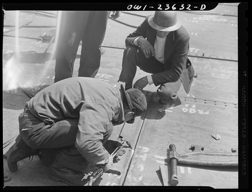 Bethlehem-Fairfield shipyards, Baltimore, Maryland. Regulating a bottom shell plating