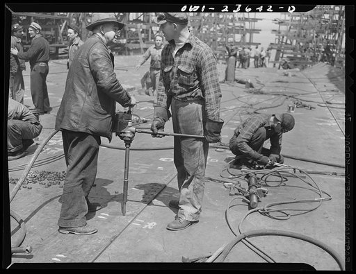 Bethlehem-Fairfield shipyards, Baltimore, Maryland. Reaming bottom shell plating rivet holes