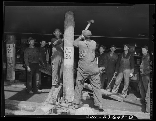 Bethlehem-Fairfield shipyards, Baltimore, Maryland. Removing the shoring preparatory to a launching ceremony