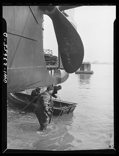 Bethlehem-Fairfield shipyards, Baltimore, Maryland. Diver preparing to inspect the outboard launching ways