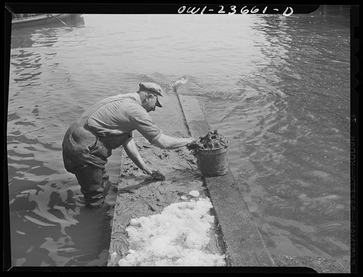 Bethlehem-Fairfield shipyards, Baltimore, Maryland. Greasing the outboard launching ways