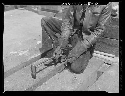 Bethlehem-Fairfield shipyards, Baltimore, Maryland. An adz used by wood workers