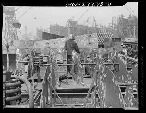 Bethlehem-Fairfield shipyards, Baltimore, Maryland. Working in an inner bottom section