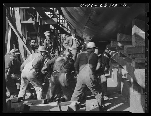 Bethlehem-Fairfield shipyards, Baltimore, Maryland. Removing shoring and berthing preparatory to the launching of a ship