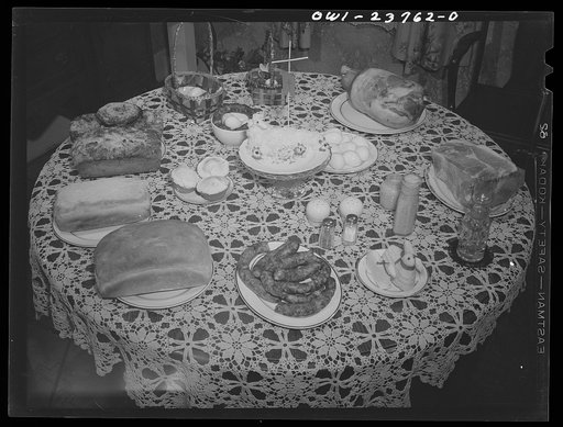 Buffalo, New York. Easter table prepared for blessing by the priest at a home in the Polish community on the day before Easter. For Poles, Easter is a day for church going, feasting and visiting. Lamb in the center of the table is made of butter