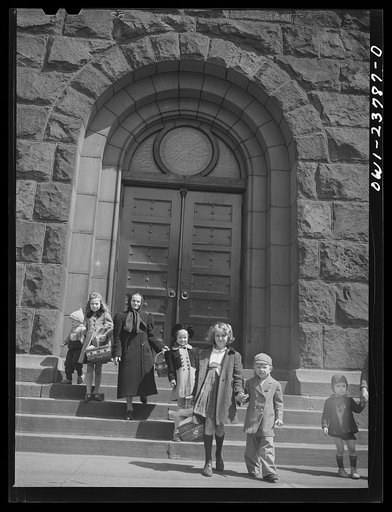 Untitled photo, possibly related to: Buffalo, New York. Children of the Polish community leaving church with baskets of food on the day before Easter. The food has been blessed by the priest to celebrate the breaking of Lenten fasting, and is eaten Easter day