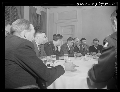 Niagara Falls, New York. Meeting of the Niagara Frontier regional committee of the United States War Manpower Commssion. After luncheon at the Lafayette Hotel, representatives of labor, industry and government are discussing problems of manpower and womanpower recruiting