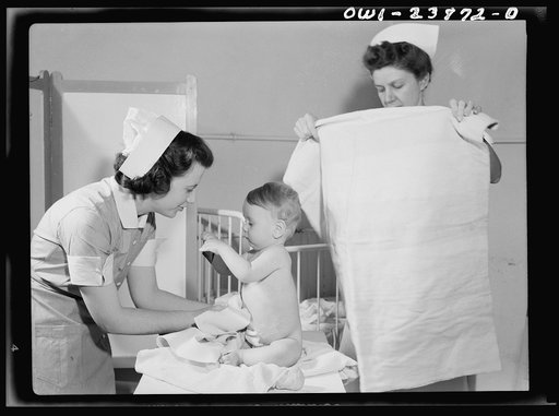 A convalescing youngster is dried after his bath by student nurse Frances Bullock, (left). Experience in the pediatric and obstetrical wards is included in every student nurse's training
