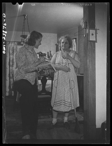 Niagara Falls, New York. Nan Hannegan doing door to door recruiting for women to work in war plants. This program was organized by the War Manpower Commission in cooperation with local war plants who loaned nineteen women workers