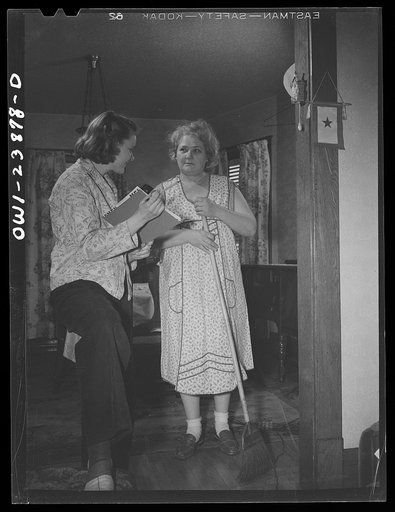 Untitled photo, possibly related to: Niagara Falls, New York. Nan Hannegan doing door to door recruiting for women to work in war plants. This program was organized by the War Manpower Commission in cooperation with local war plants who loaned nineteen women workers