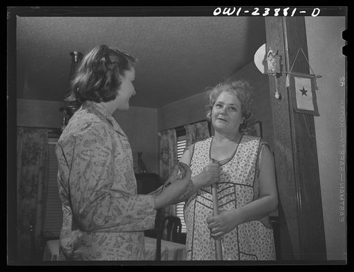 Niagara Falls, New York. Nan Hannegan doing door to door recruiting for women to work in war plants. This program was organized by the War Manpower Commission in cooperation with local war plants who loaned nineteen women workers