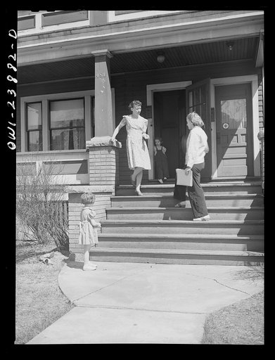 Untitled photo, possibly related to: Niagara Falls, New York. Nan Hannegan doing door to door recruiting for women to work in war plants. This program was organized by the War Manpower Commission in coopration with local war plants who loaned nineteen women workers