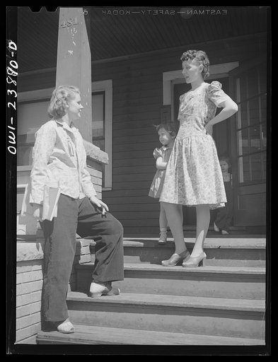 Niagara Falls, New York. Nan Hannegan doing door to door recruiting for women to work in war plants. This program was organized by the War Manpower Commission in cooperation with local war plants who loaned nineteen women workers