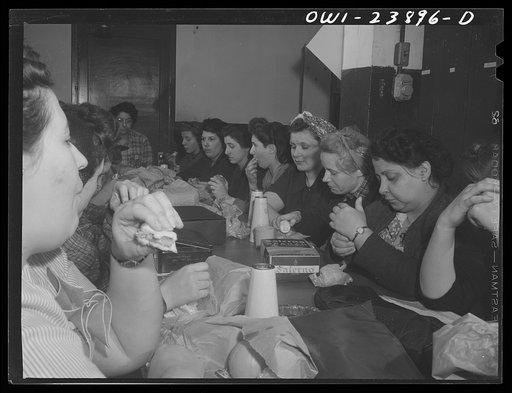Buffalo, New York. Women employees eating lunches brought from home at Ross Heater, makers of condensers for the Navy. There are no eating facilities in the plant, and since there is only a thirty-minute period, most workers bring lunches