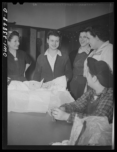 Buffalo, New York. Cecelia Wrazen, who works at the Ross Heater plant, is engaged to a precision lathe operator in the same plant. Fellow workers presenting Cecelia with a wedding gift
