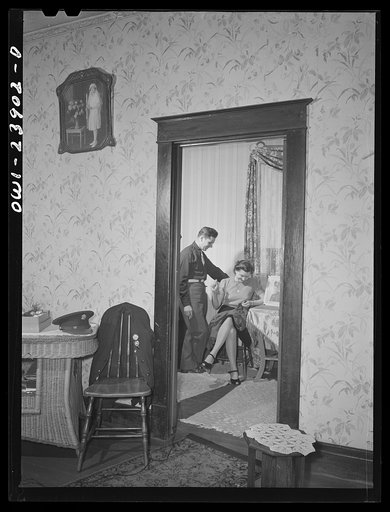 Buffalo, New York. Laura and Frank Czaya, a couple of Polish descent, in the bedroom of the home which they share with Laura's mother, aunt, and brother, in Depew. Frank is home on a ten-day furlough. Laura works in the nearby Symington-Gould plant