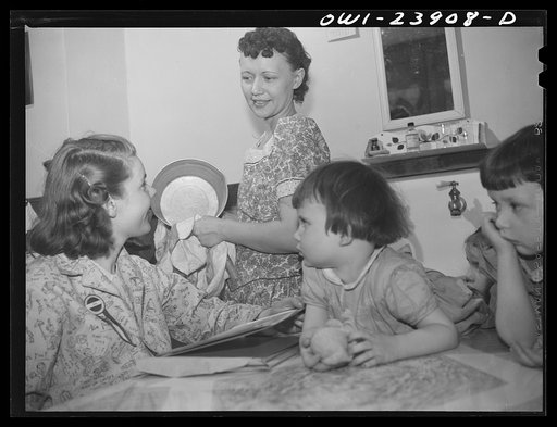 Niagra Falls, New York. Nan Hannegan doing door to door recruiting for women to work in war plants. This program was organized by the War Manpower Commission in cooperation with local war plants who loaned nineteen women workers