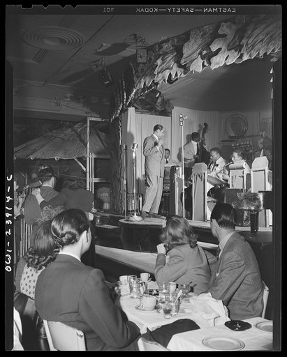 New York, New York. Duke Ellington directs his band during a broadcast over WOR