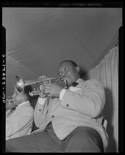 New York, New York. Rex Stewart, trumpeter with Duke Ellington's orchestra, at the Hurricane cabaret